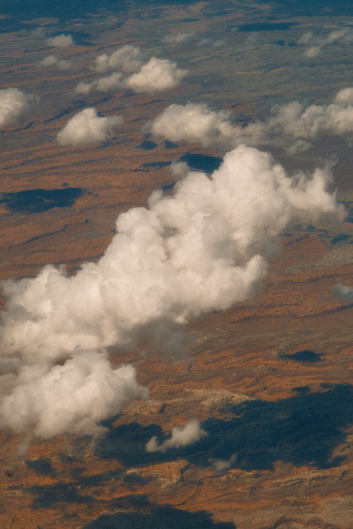 Clouds over red-rock desert canyon country, seen from Tyler Einberger's flight to San Diego for brightonSEO San Diego 2026